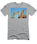 Two Cheetahs Standing and Sitting on Rocks Against Blue Sylvain Cordier Natureplcom T-Shirt